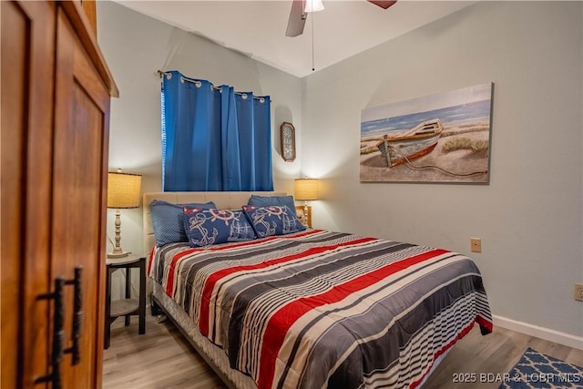 bedroom with ceiling fan and light wood-type flooring