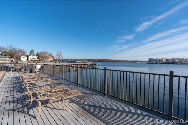 wooden deck featuring a water view