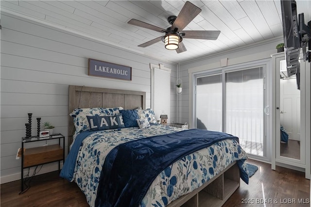 bedroom featuring access to outside, multiple windows, ceiling fan, and dark hardwood / wood-style flooring