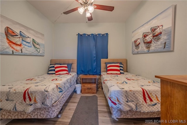 bedroom with hardwood / wood-style flooring and ceiling fan