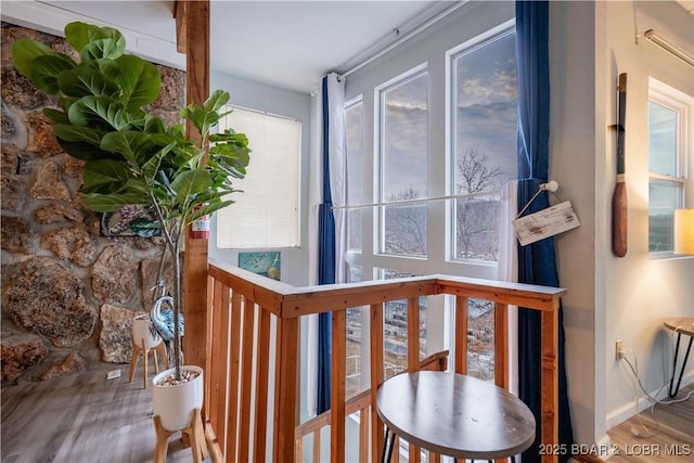 hallway with hardwood / wood-style floors