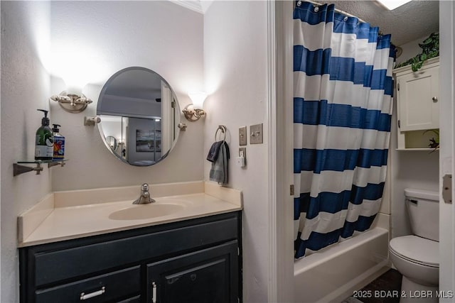 full bathroom with vanity, a textured ceiling, toilet, and shower / bath combo with shower curtain