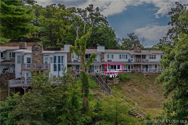 back of house featuring a deck