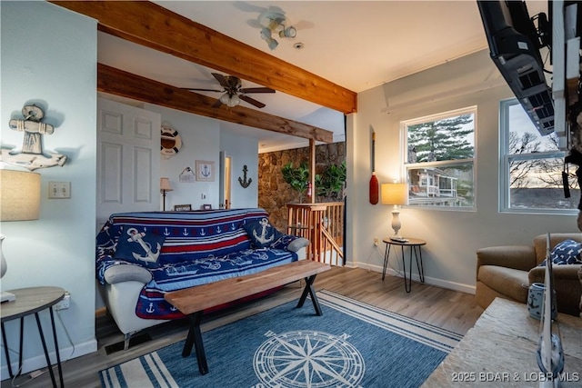 interior space featuring ceiling fan, beamed ceiling, and wood-type flooring