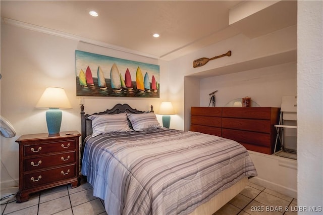 bedroom featuring crown molding and light tile patterned flooring