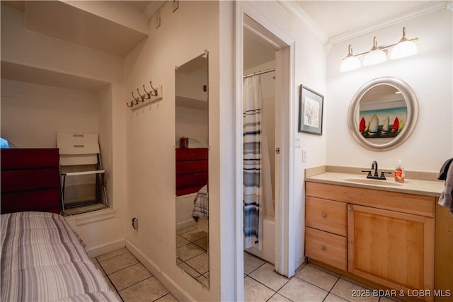 bathroom with tile patterned flooring, vanity, and ornamental molding