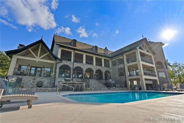 view of pool featuring a patio