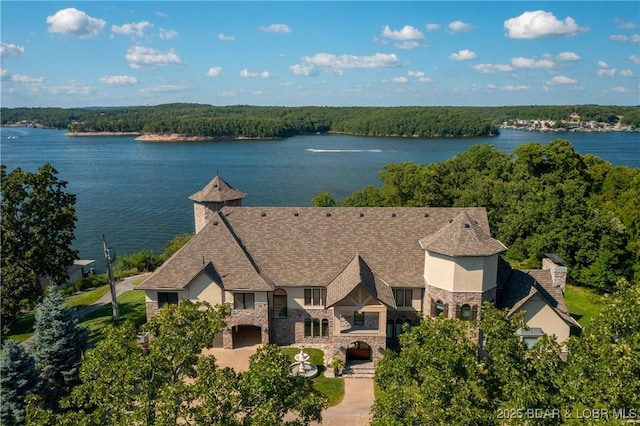 birds eye view of property with a water view