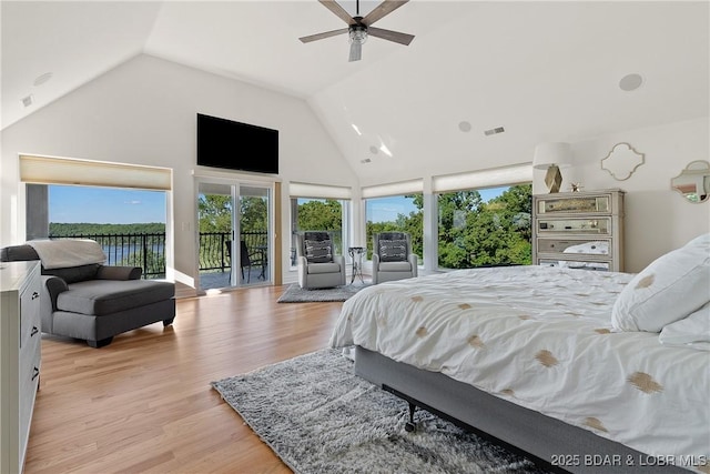 bedroom featuring access to exterior, ceiling fan, high vaulted ceiling, and light wood-type flooring