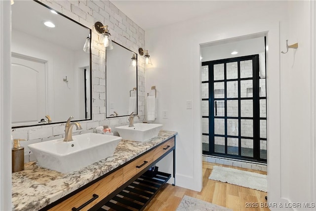 bathroom with vanity and hardwood / wood-style flooring