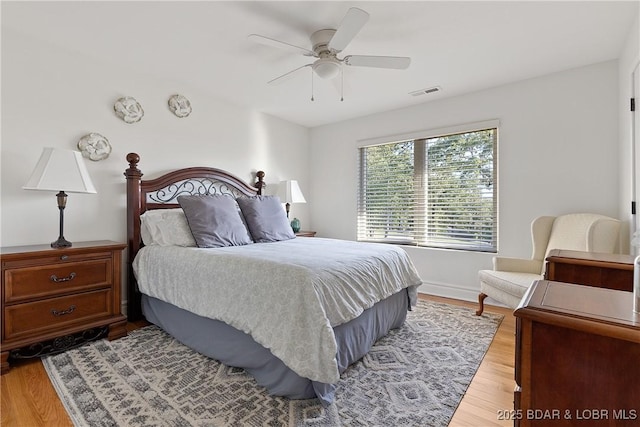 bedroom with ceiling fan and light wood-type flooring