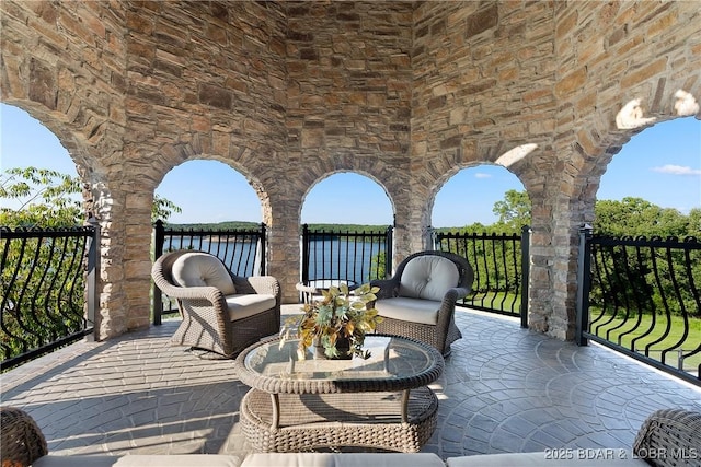 view of patio featuring a water view