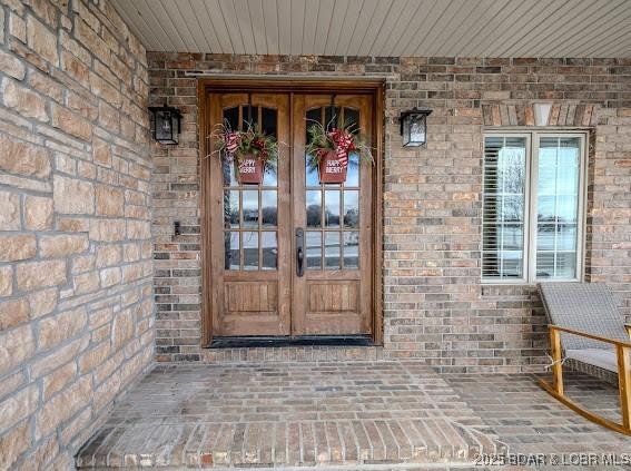 entrance to property featuring french doors