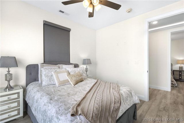 bedroom featuring light hardwood / wood-style floors and ceiling fan