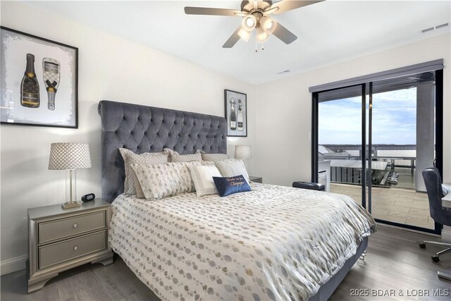 bedroom with access to outside, ceiling fan, and dark hardwood / wood-style flooring