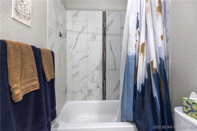 bathroom featuring toilet and shower / tub combo with curtain