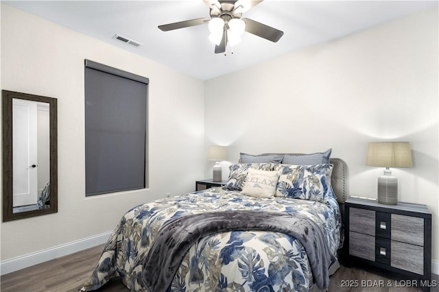 bedroom featuring ceiling fan and dark hardwood / wood-style floors