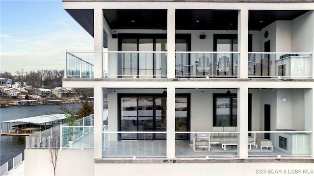 exterior space with a water view and a balcony