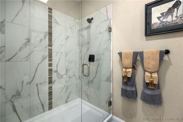 bathroom with a shower with shower door