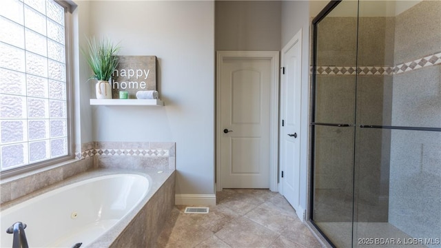 bathroom featuring separate shower and tub and a wealth of natural light