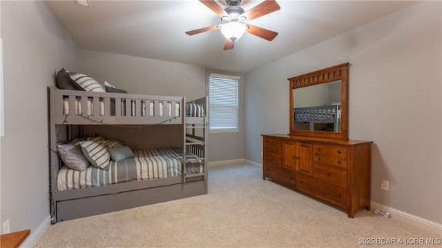 bedroom with light carpet and ceiling fan