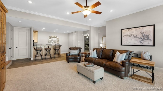 tiled living room featuring ceiling fan and ornamental molding