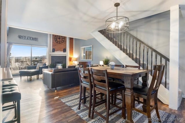 dining room with an inviting chandelier and wood-type flooring