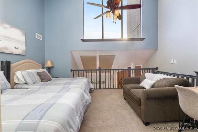 carpeted bedroom with ceiling fan