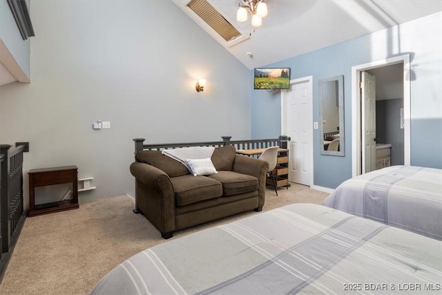 carpeted bedroom featuring ceiling fan, ensuite bath, and lofted ceiling