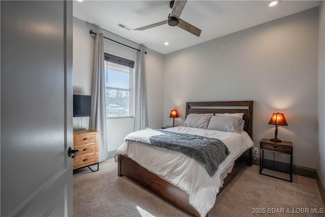 bedroom featuring ceiling fan and light carpet