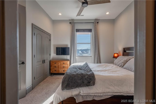 carpeted bedroom featuring ceiling fan