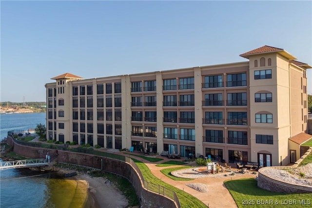 view of building exterior featuring a water view