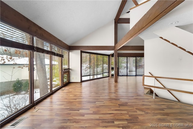 unfurnished sunroom with lofted ceiling