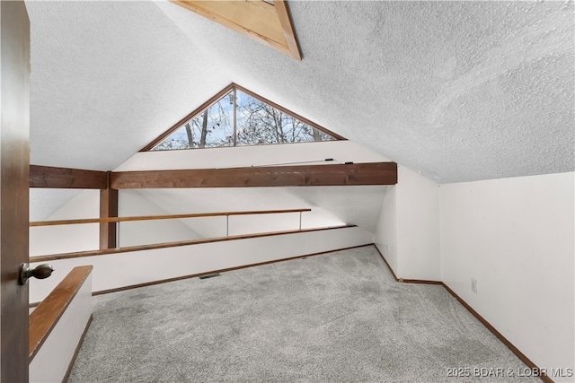 additional living space with light colored carpet and lofted ceiling