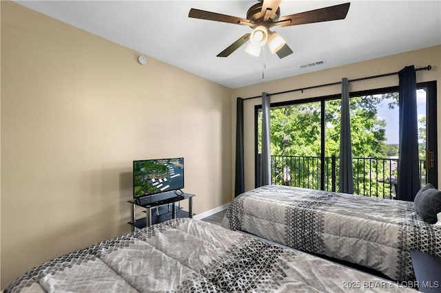 bedroom with access to outside and ceiling fan