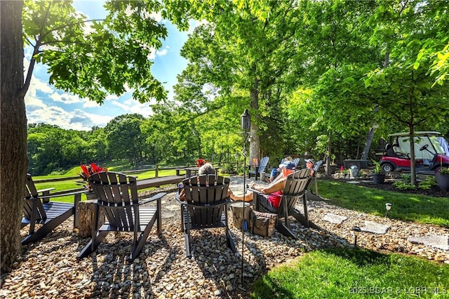 view of yard with a fire pit