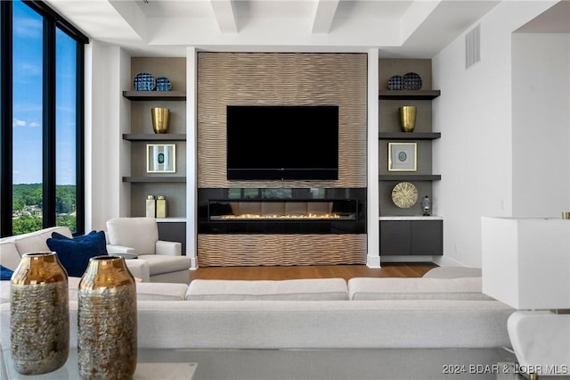 living room with wood-type flooring and built in features