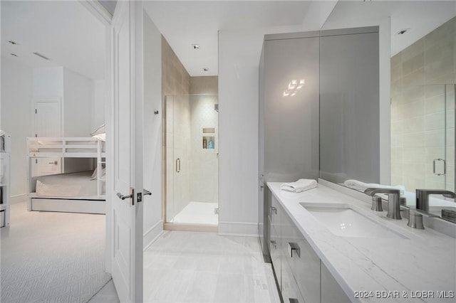 bathroom with vanity and an enclosed shower