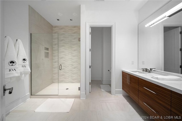 bathroom with vanity and an enclosed shower