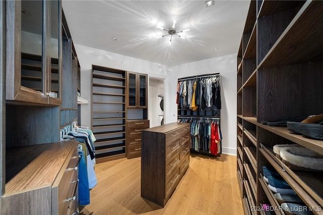 spacious closet featuring light hardwood / wood-style floors