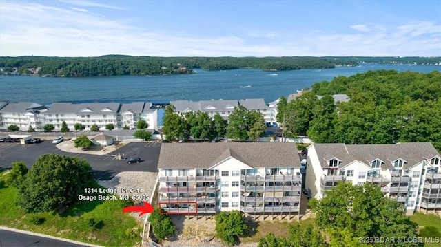 birds eye view of property featuring a water view