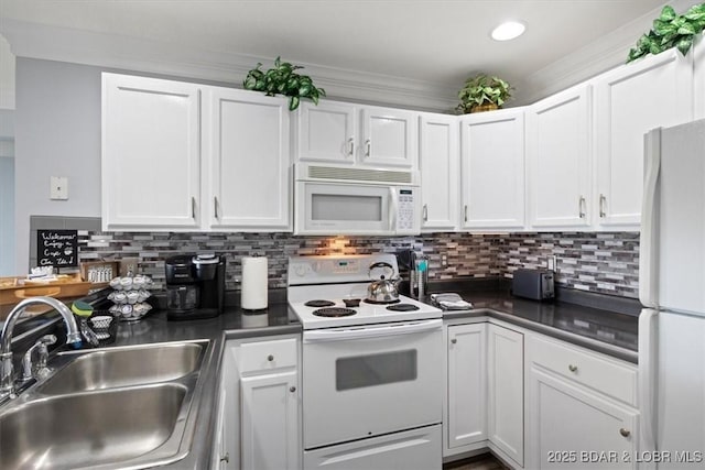 kitchen with decorative backsplash, white cabinetry, sink, and white appliances