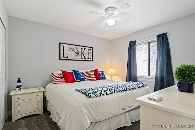 bedroom with dark carpet and ceiling fan