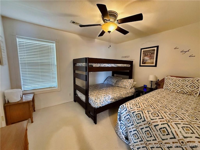 2500 Bay Point Ln Unit 234, Osage Beach, MO 65065 - carpeted bedroom with baseboards, ceiling fan, and visible vents
