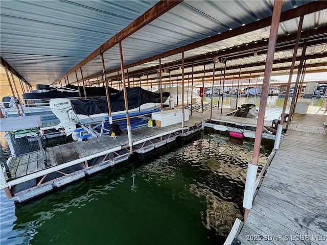 2500 Bay Point Ln Unit 234, Osage Beach, MO 65065 - view of dock featuring a water view and boat lift