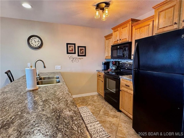 2500 Bay Point Ln Unit 234, Osage Beach, MO 65065 - kitchen with a sink, light tile patterned flooring, black appliances, baseboards, and dark countertops