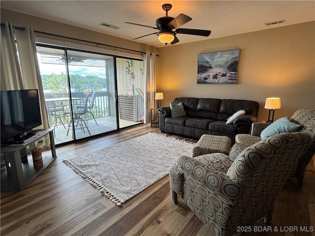 2500 Bay Point Ln Unit 234, Osage Beach, MO 65065 - living room featuring ceiling fan, visible vents, and wood finished floors