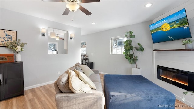 bedroom featuring ceiling fan and light wood-type flooring