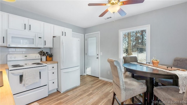 kitchen with ceiling fan, tasteful backsplash, light hardwood / wood-style floors, white appliances, and white cabinets