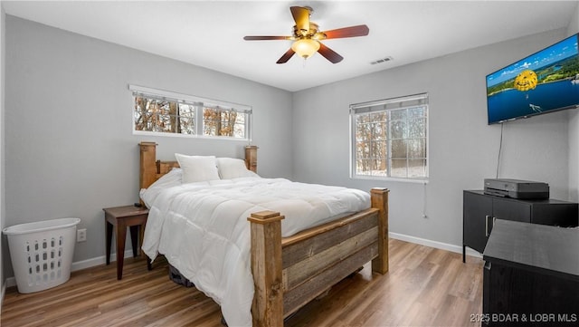 bedroom with hardwood / wood-style flooring and ceiling fan